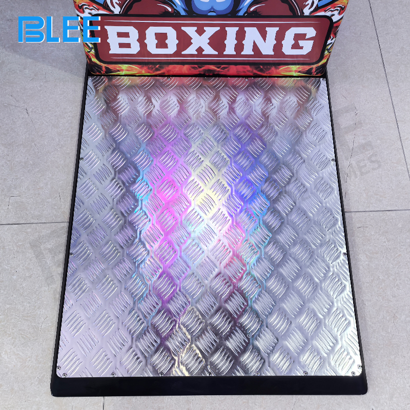 Player delivering powerful punch to the boxing machine's impact sensor with proper form