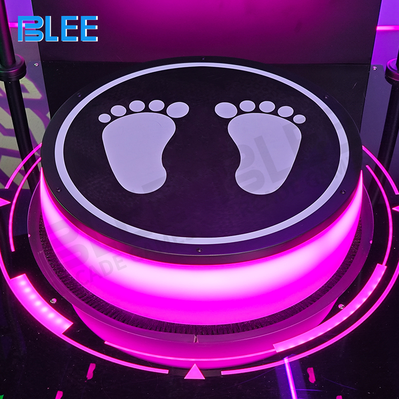 Player using full-body movements to control Pac-Man navigation on large display