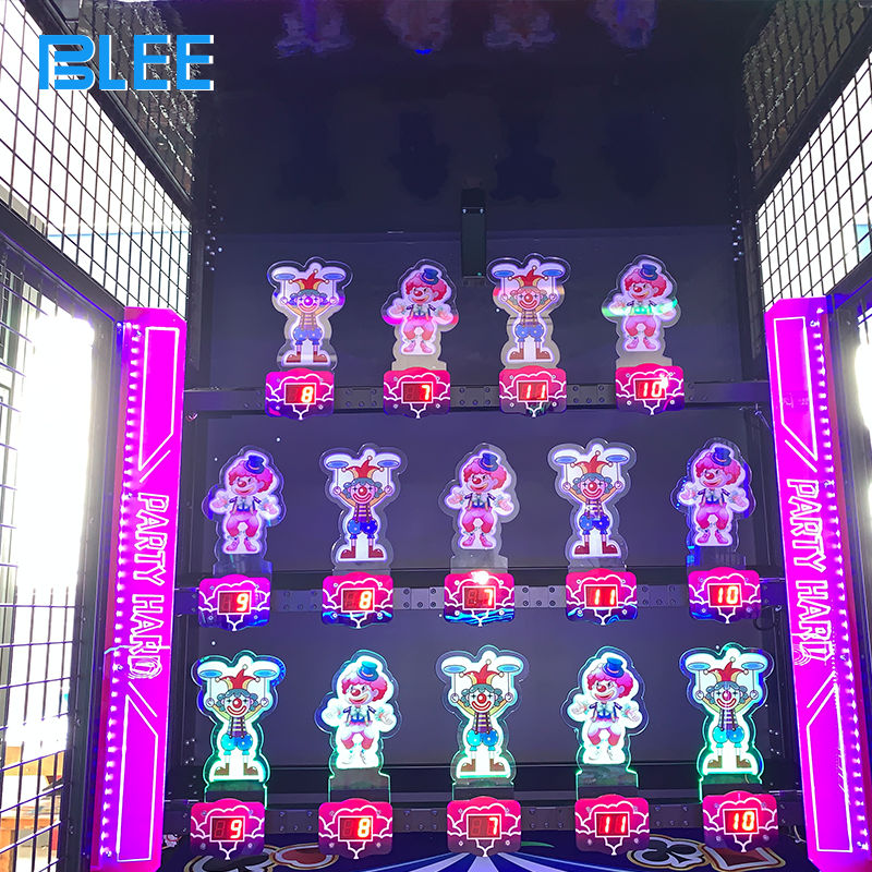 Close-up action sequence showing player timing button press to shoot ball at target clown doll