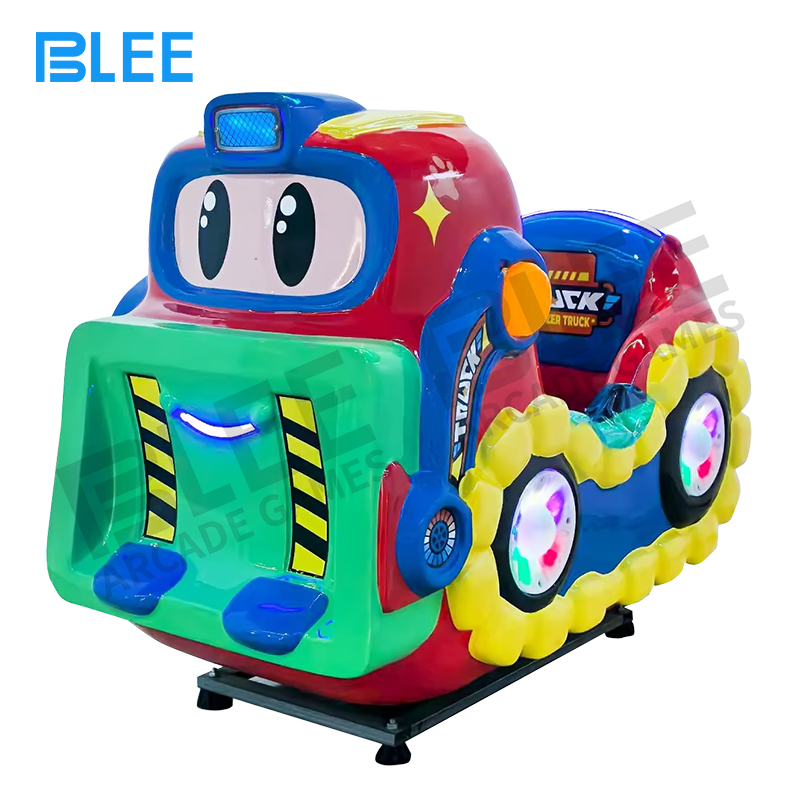 construction themed amusement Child operating the bulldozer rocking machine with hands on interactive steering wheel controls