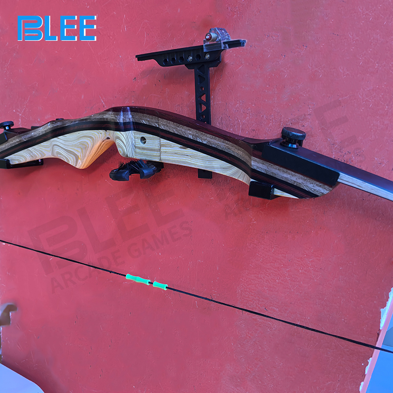 Interactive gameplay system combining physical balance challenges with archery skill development