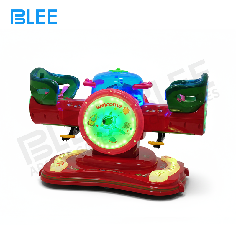 double kiddie ride Child riding the bunny rocker with hands holding the soft bunny ear grips