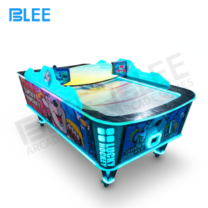 Close-up of the curved acrylic playing field showing how puck trajectory changes with surface contours