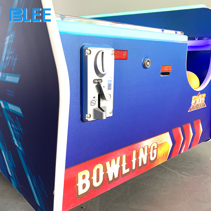 Family enjoying bowling action together on BLEE compact redemption bowling game in entertainment center