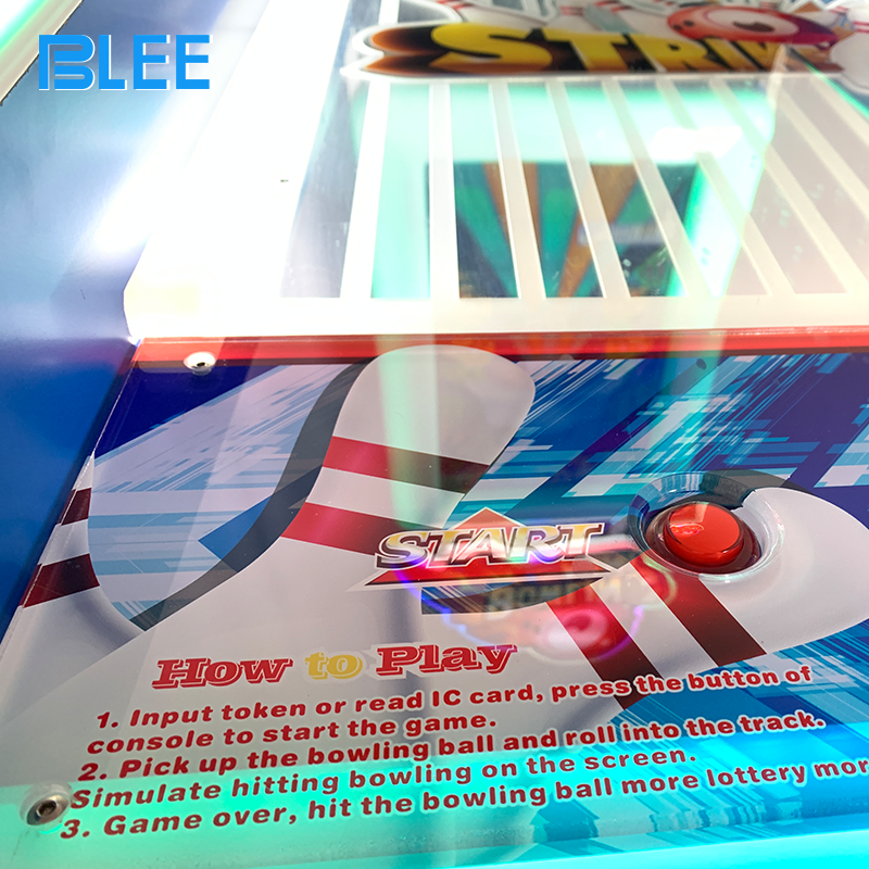 Ticket and gift dispensing system in action rewarding players based on bowling score performance