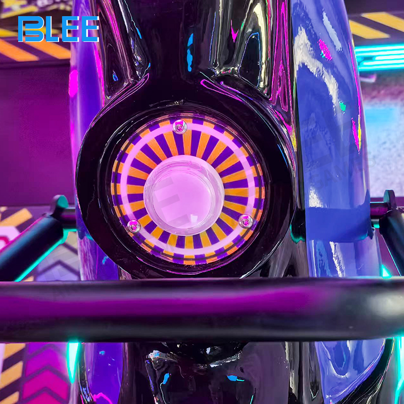 Detailed shot of the coin slot and large start button interface designed for easy child operation