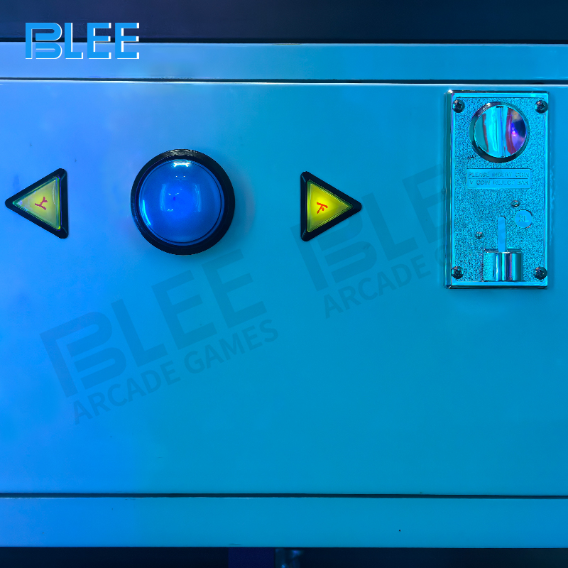 Player striking ping pong ball toward 65-inch display with match-3 game interface