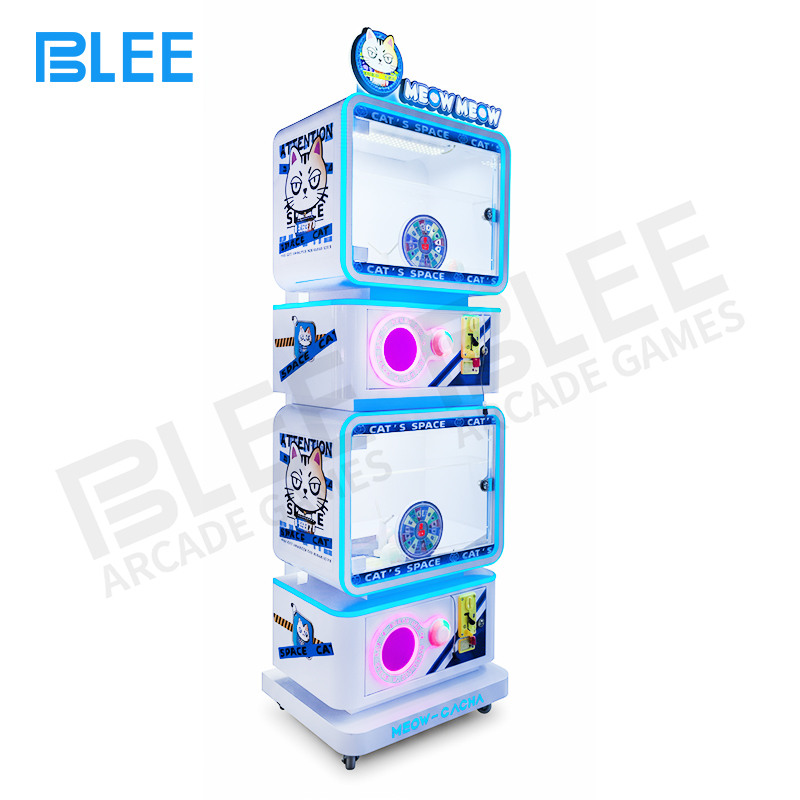 interactive vending equipment Player receiving capsule prize from the machine's collection tray