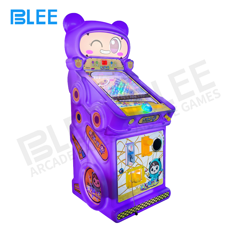 kids fantasy game Child playing with oversized flipper controls and marble tracks