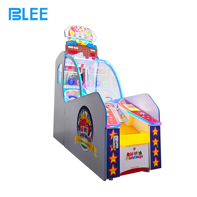 sports arcade machine Multiple players gathered around Mini Sandbags machine during peak hours at family entertainment center