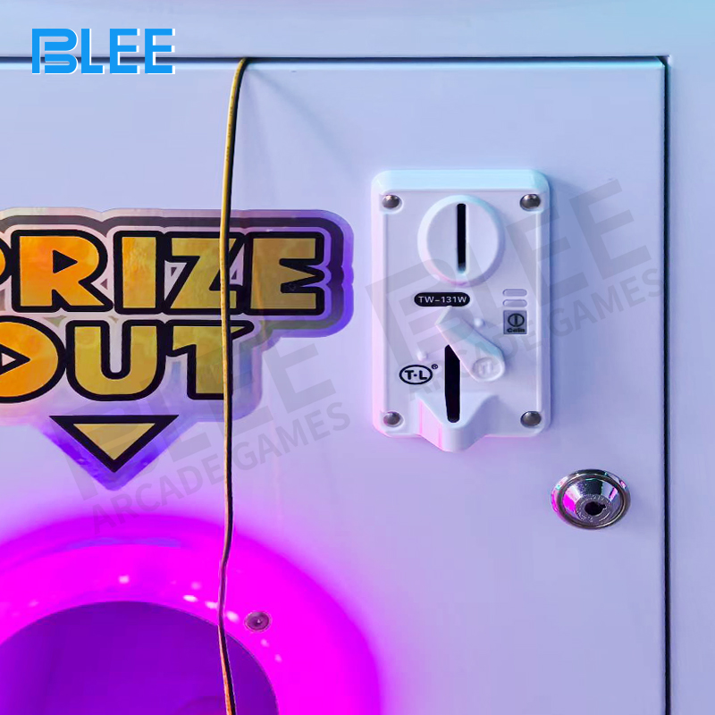 Prizes dropping directly into the collection chute after a successful draw