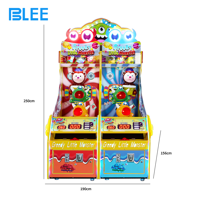 Family group enjoying monster feeding gameplay together on BLEE redemption machine in entertainment center setting