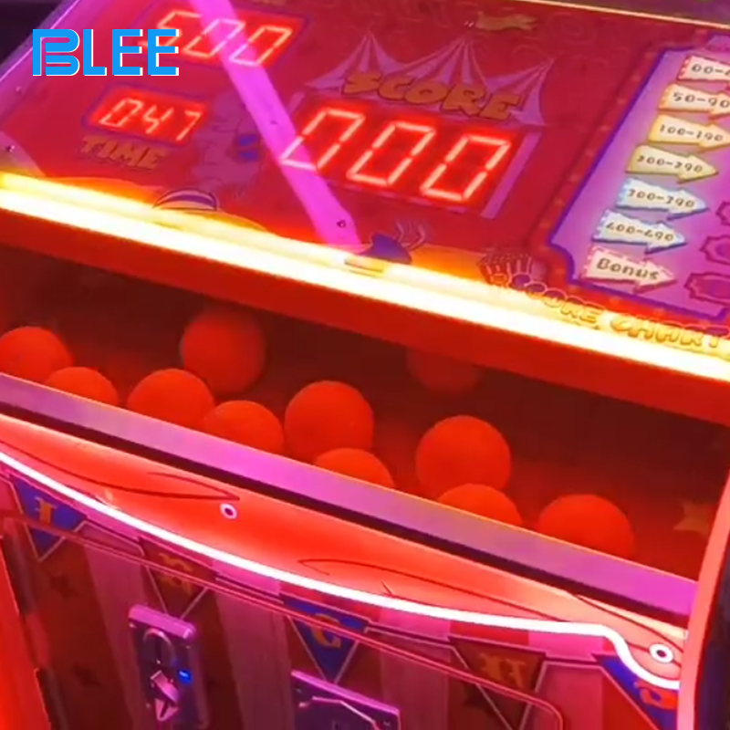 Multi-generational family group enjoying festive gameplay experience on the celebration-themed redemption machine