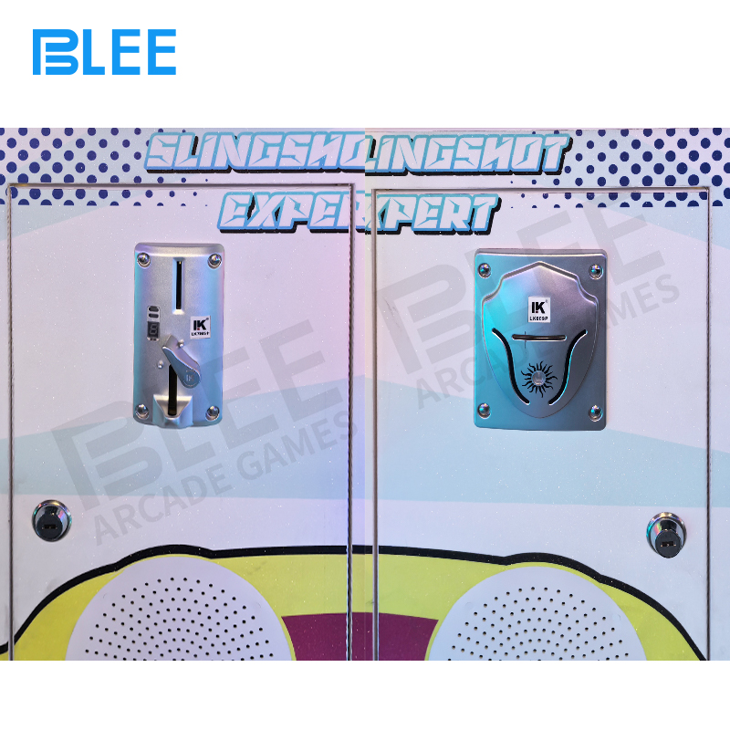 Fixed pillars providing cover and strategic shooting positions within game cabinet