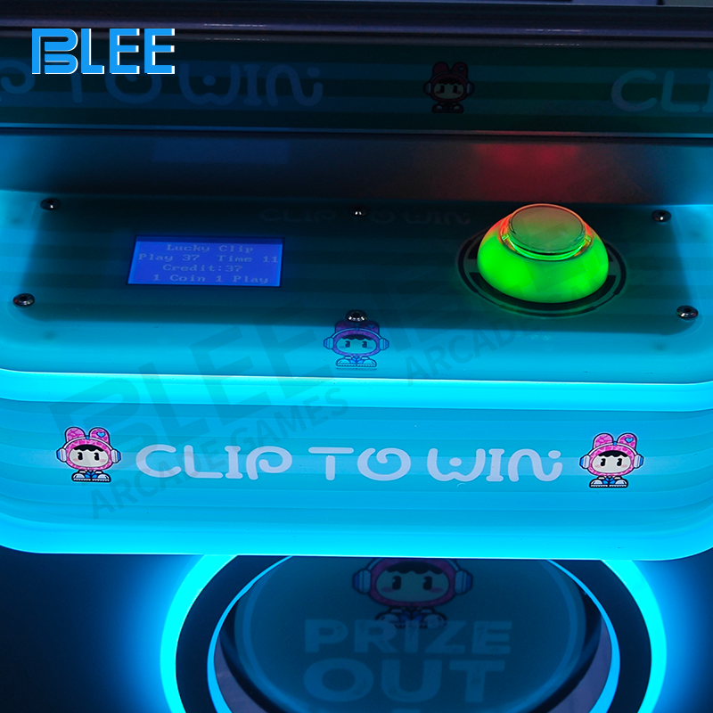 Player operating the BLEEE Crazy Clown 2 Gift Claw Machine at a family entertainment center.