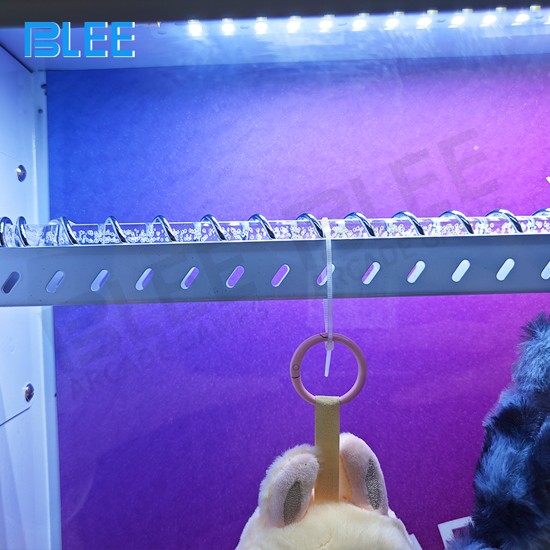 Dynamic LED lighting illuminating mole holes and scoring display during gameplay