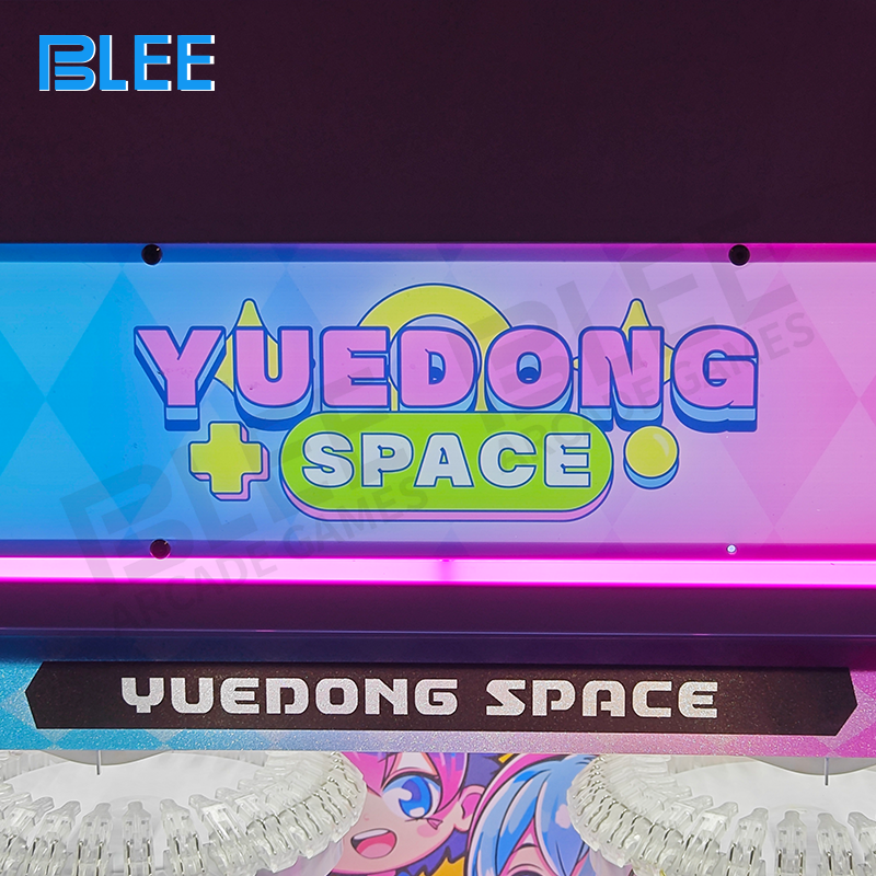 Close-up showing the two independent claws positioned over the same collection of prizes.