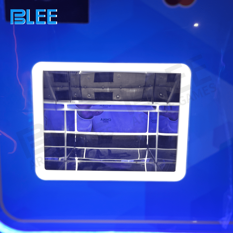 A customer's hand using the touchscreen to select payment method and token quantity.