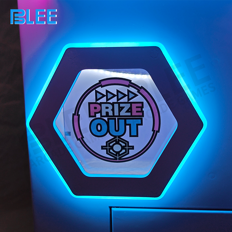 Two players simultaneously operating independent claw controls during competitive gameplay