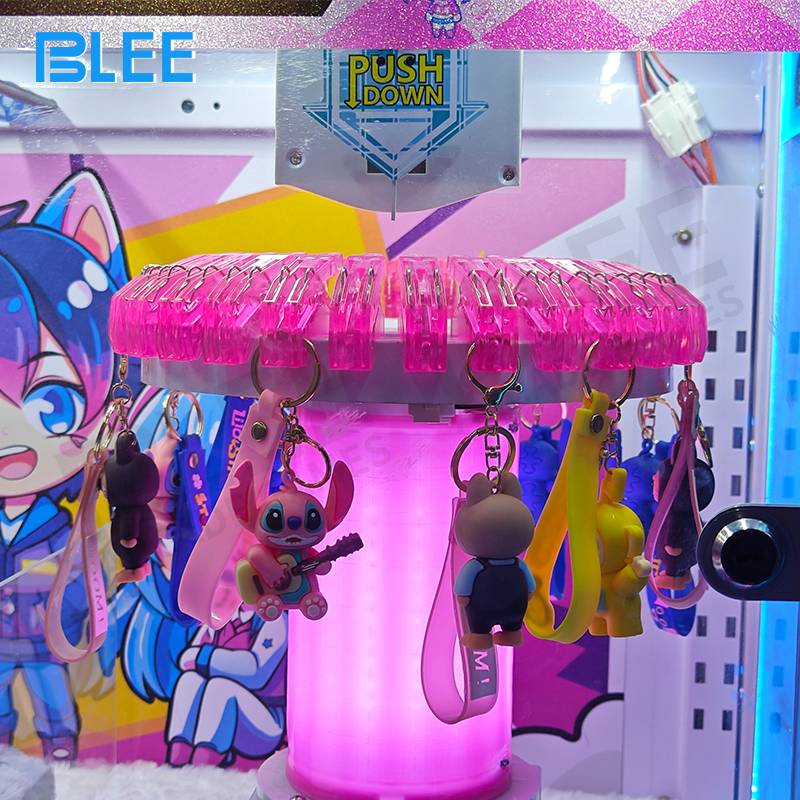 Players coordinating claw movements for collaborative prize capture strategy