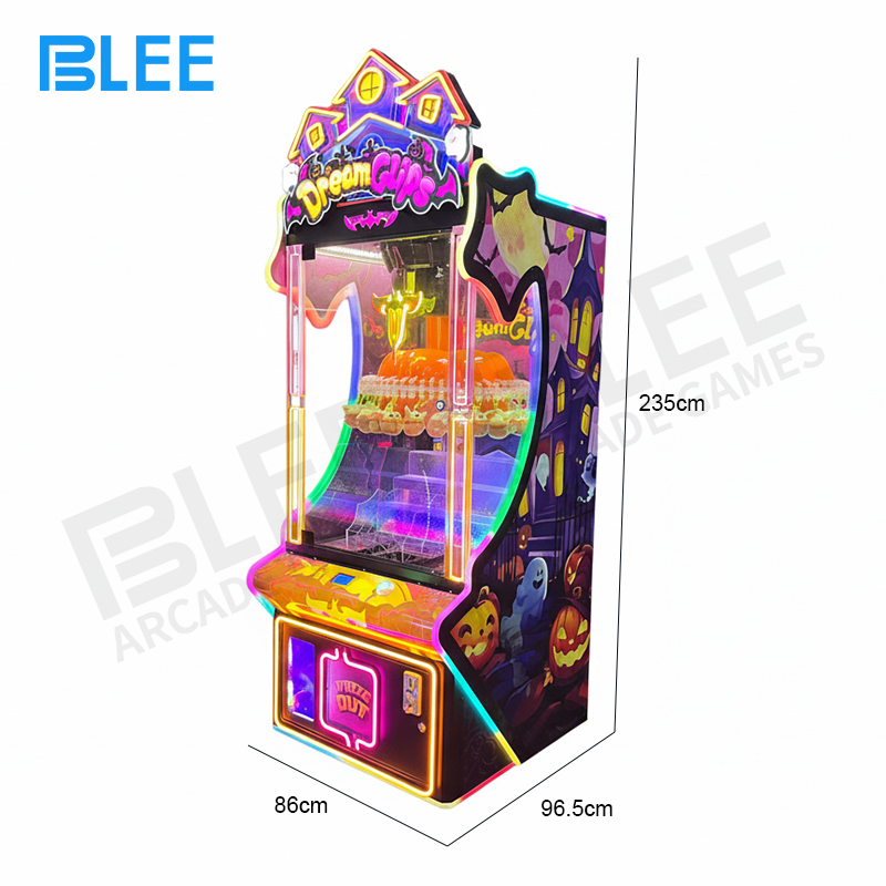 A player intently using the joystick to position one of the 60 claws over a desirable prize.