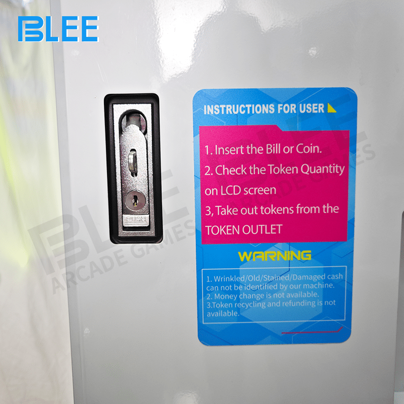 A customer inserting coins into the multi-denomination coin acceptor slot on the front panel.
