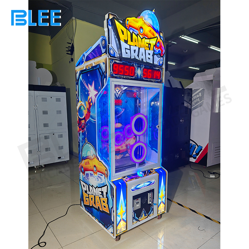 Player aiming and tossing a caught ball into one of the colored scoring holes (red/green/blue).