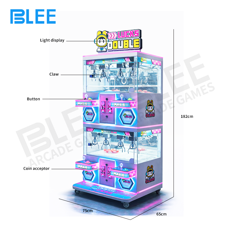 Close-up of a player's station with two joysticks for controlling paired claws.