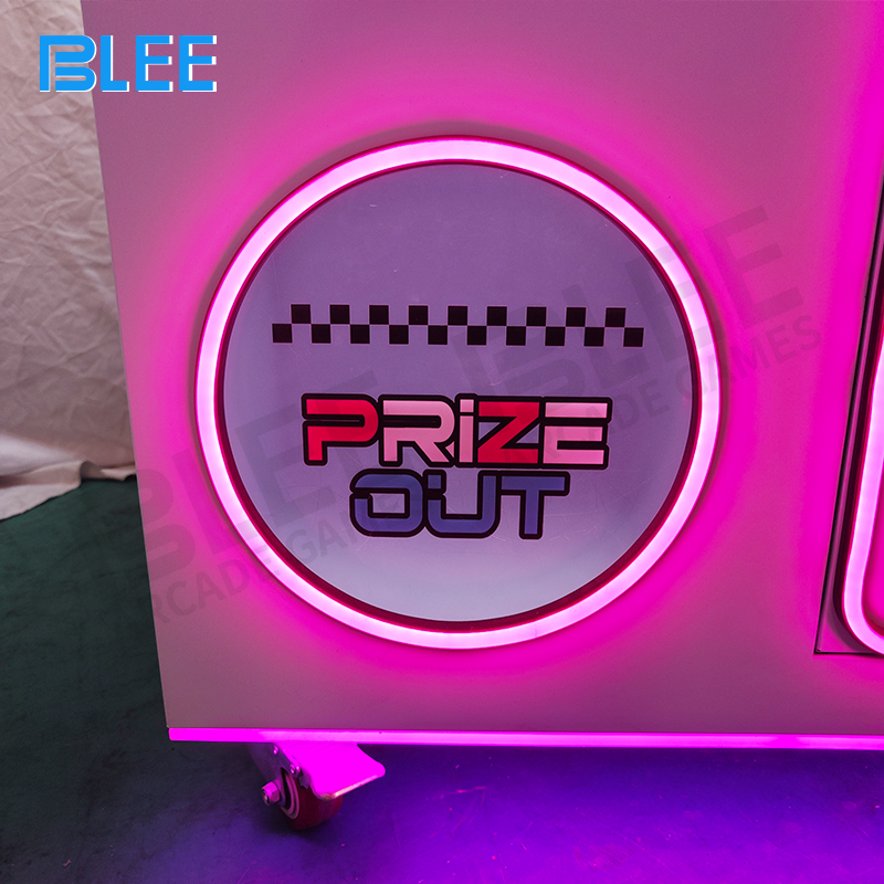 Dynamic LED lighting system highlighting both claw operation zones and prize display