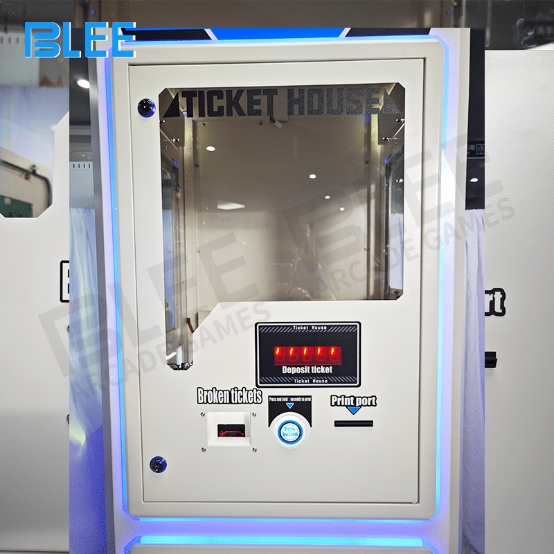 Coin output tray on each side dispensing tokens for continued arcade gameplay.