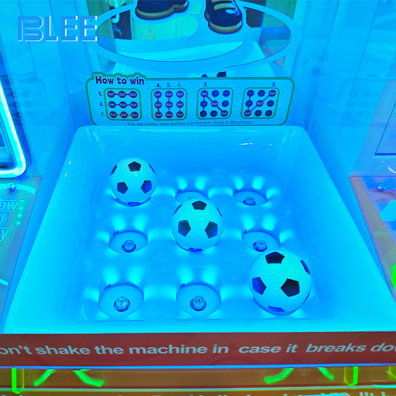 Player inserting coins into the payment system to activate pinball gameplay.