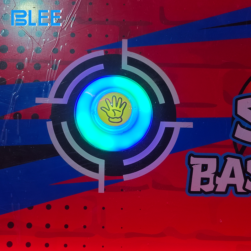 Player inserting coins into the payment system to activate video basketball gameplay.