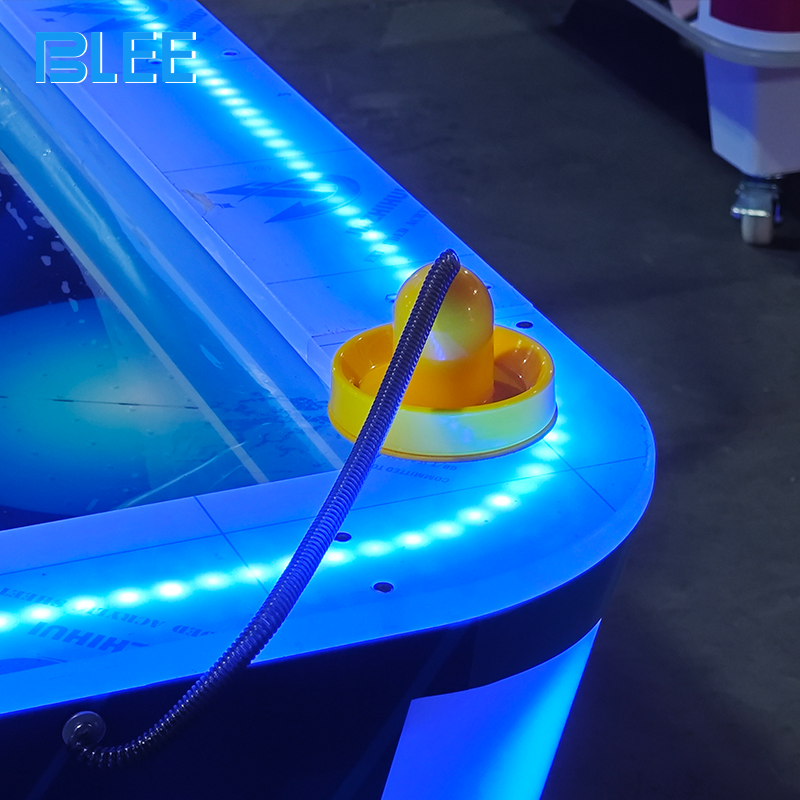 Integrated ticket dispenser mechanism issuing rewards based on final scores.