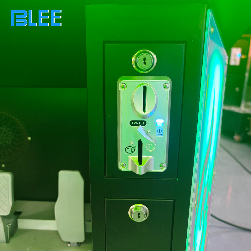 Player inserting coins into the illuminated payment system to begin the King Kong race.