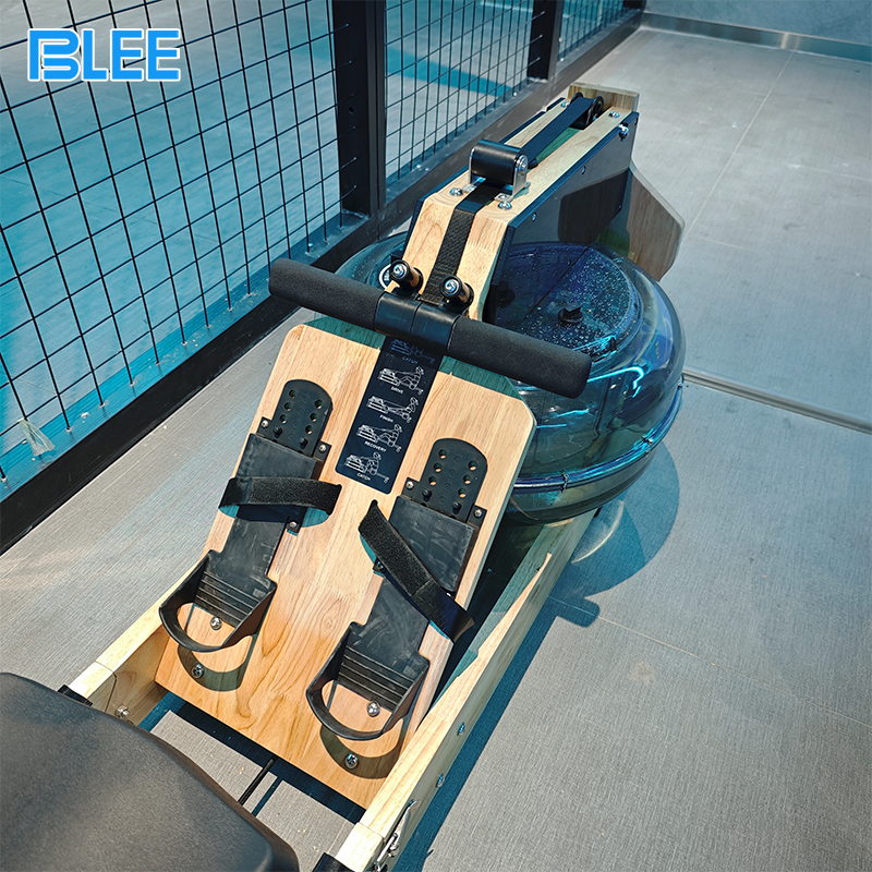Full front view showcasing the rowing machine, motion tracking sensors, and real-time performance monitor.