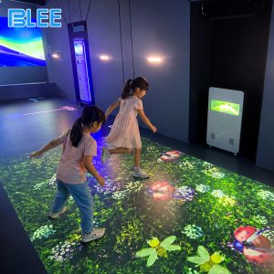 Interactive floor game machine with colorful digital scenes