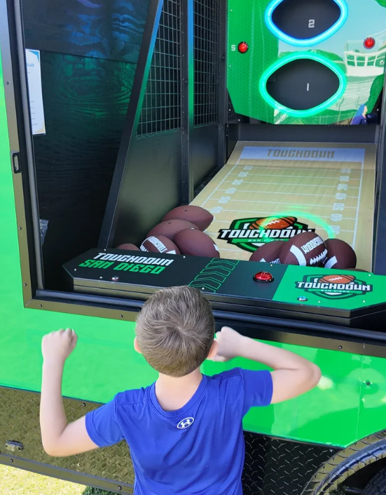 Gridiron Rush arcade machine with slanted ramp and target holes